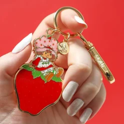 Sitting On A Strawberry Enamel Key Ring