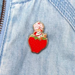 Sitting On A Strawberry Enamel Pin