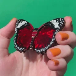Wings Laced In Red Brooch