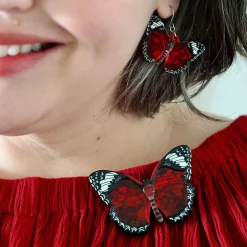 Wings Laced In Red Brooch